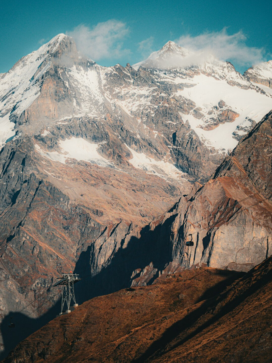 Camera and tripod set up outdoors in the Swiss Alps for a video shoot