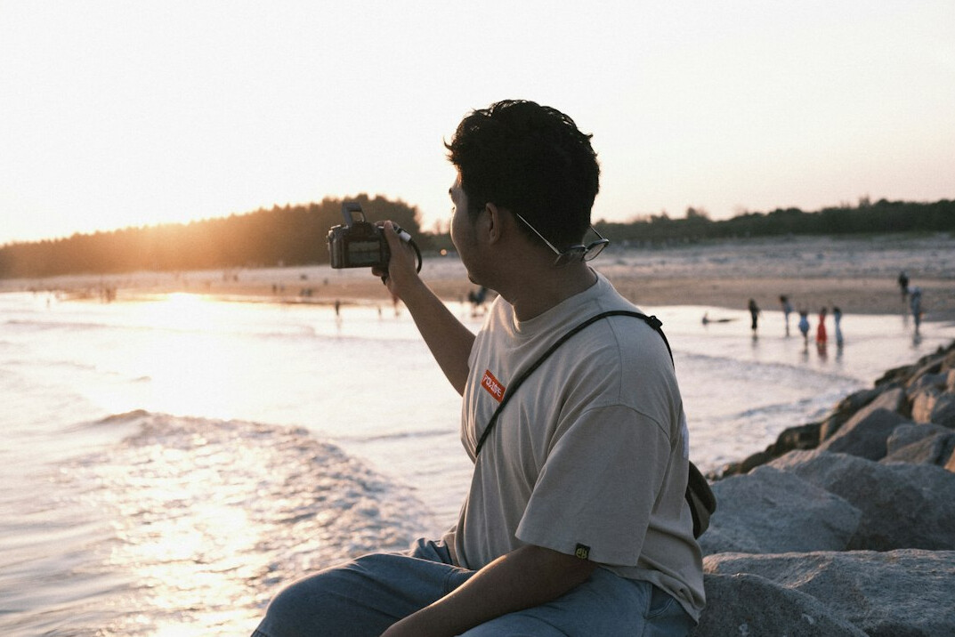 person filming outdoors